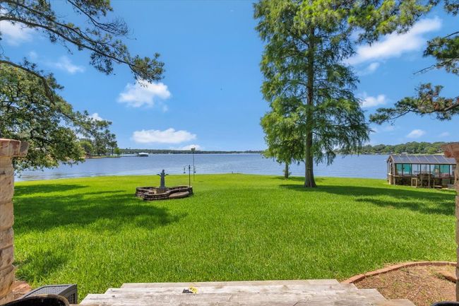 View of grassy yard with a water view | Image 9