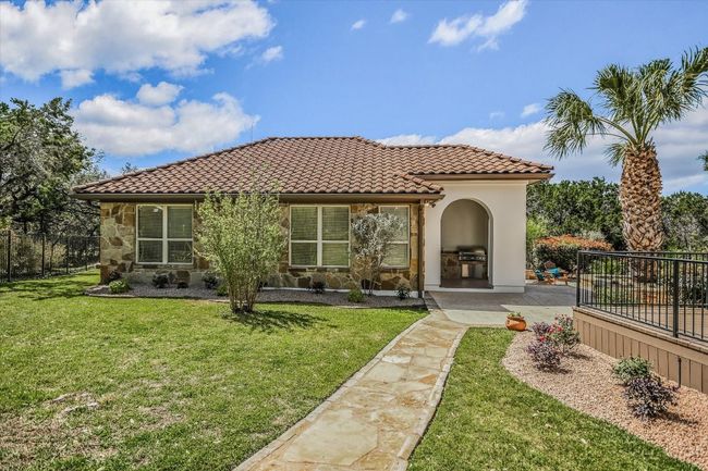 Mediterranean Style Detached One Story Casita featuring two bedrooms, a bonus room, living room and one full bath. Outdoor kitchen attached at front entrance of the casita | Image 9