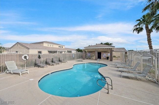 Community pool with a patio area | Image 24