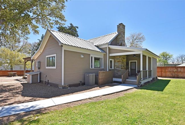 The rear of the guest house. The back porch is also covered and has great views of the play area. | Image 45