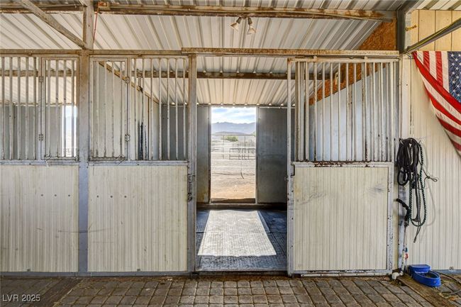 Stable featuring a mountain view | Image 33