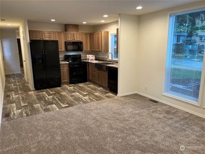 Looking at kitchen from living room. | Image 3