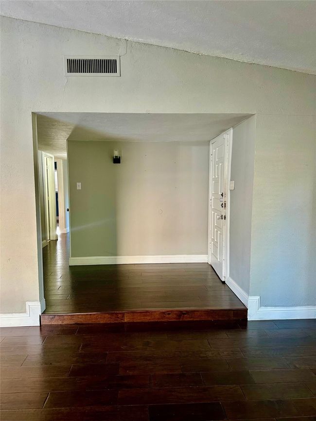 Hall featuring wood finished floors | Image 6