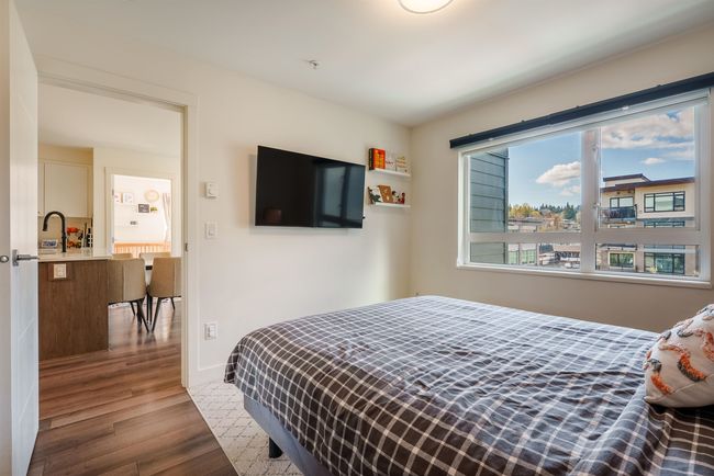 Bedroom featuring wood finished floors and baseboards | Image 13
