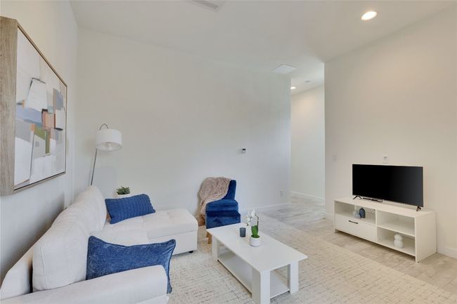Living room with recessed lighting and light wood-type flooring | Image 40