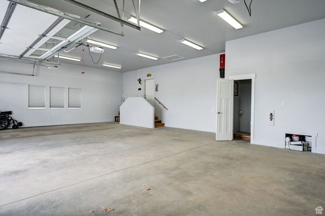 Garage featuring a garage door opener | Image 108
