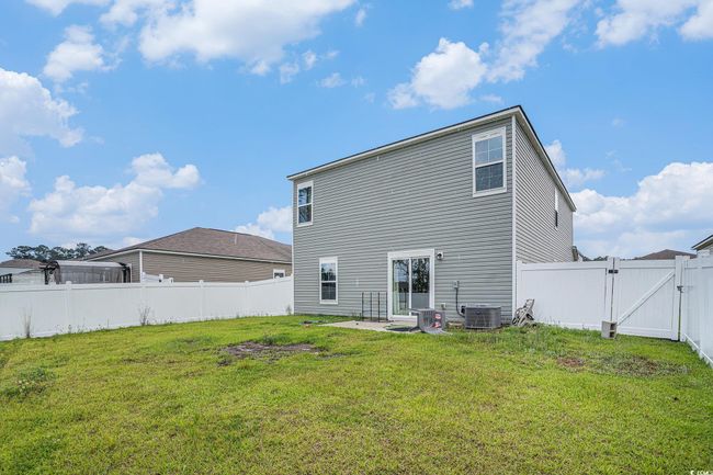 Back of property featuring a gate and central air condition unit | Image 28