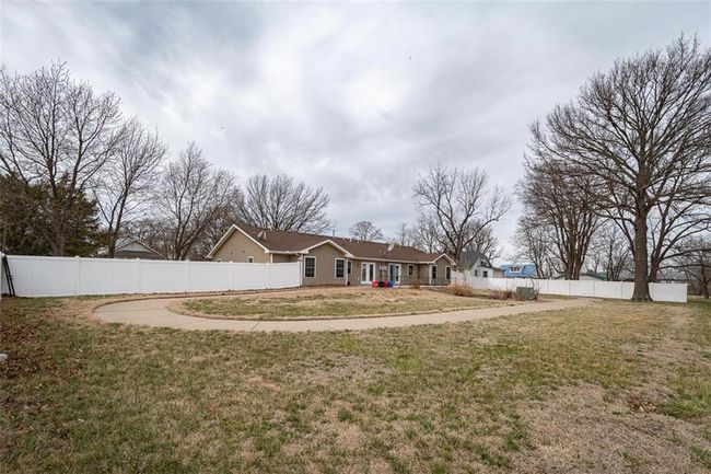 View of front of property with a front yard and fence | Image 45