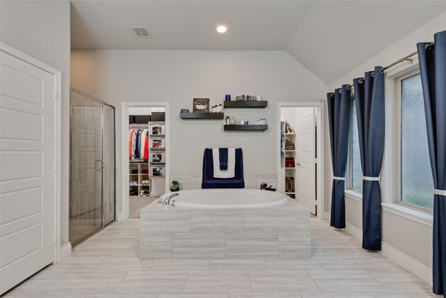 Spacious primary bathroom with soaking tub and separate shower | Image 16