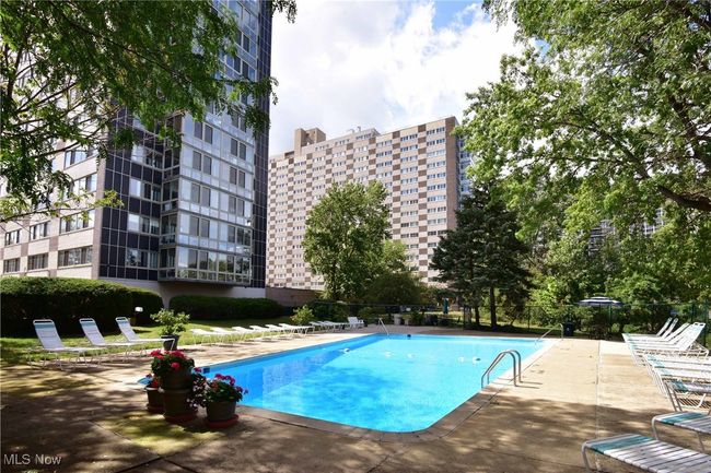 Community pool with a patio | Image 38