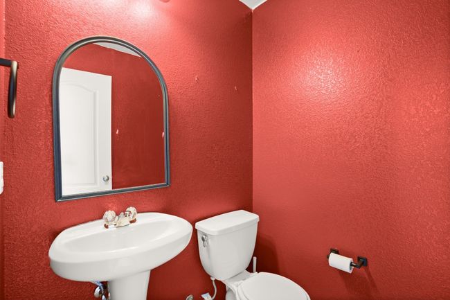 Half bathroom with a sink and toilet | Image 29