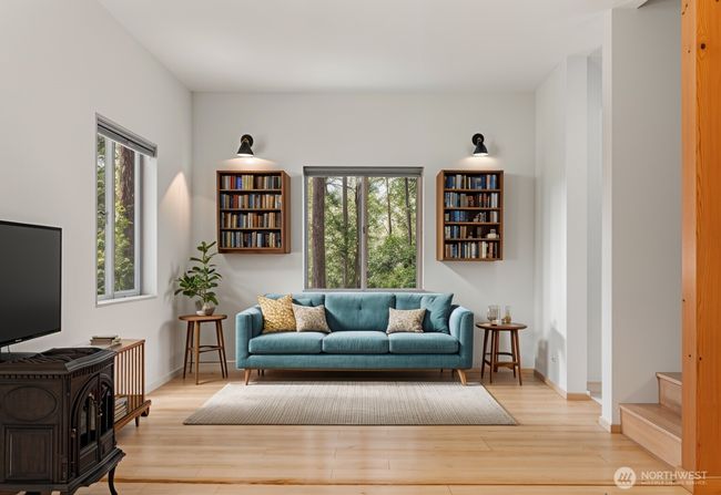 Stairs to upper floor seen here. This living room is virtually staged. | Image 13