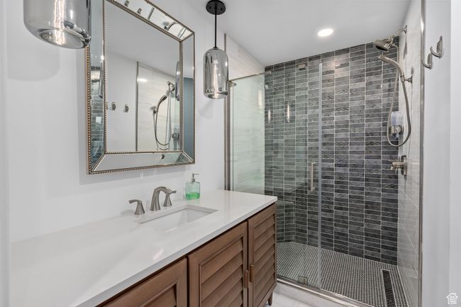 Ensuite Bathroom for bedroom #2 with vanity and an enclosed shower | Image 32