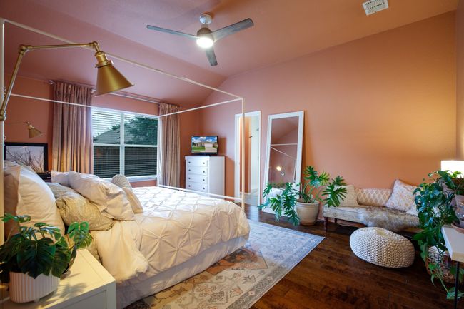 Bedroom featuring lofted ceiling, hardwood / wood-style floors, and a ceiling fan | Image 12