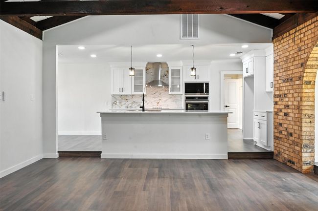 Large kitchen island leaves plenty of room for barstool seating. | Image 6
