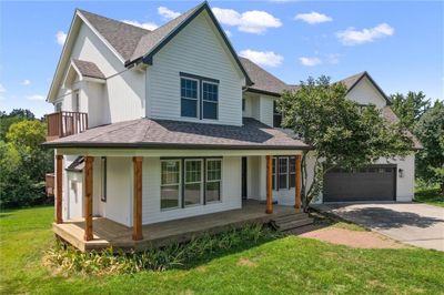 View of front of home with covered porch and a front lawn | Image 3