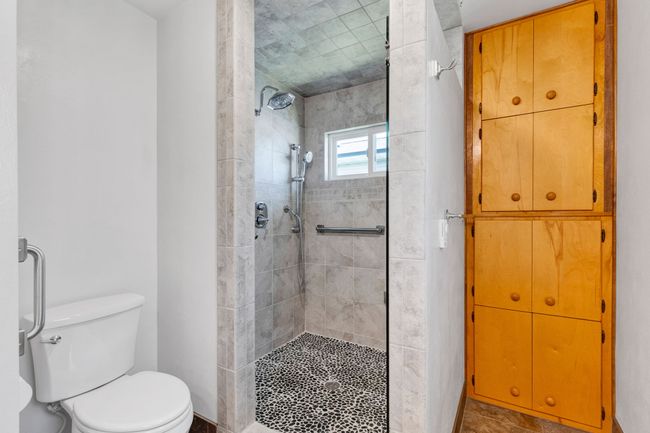 Bathroom featuring tile patterned floors, vanity, toilet, and baseboards | Image 14