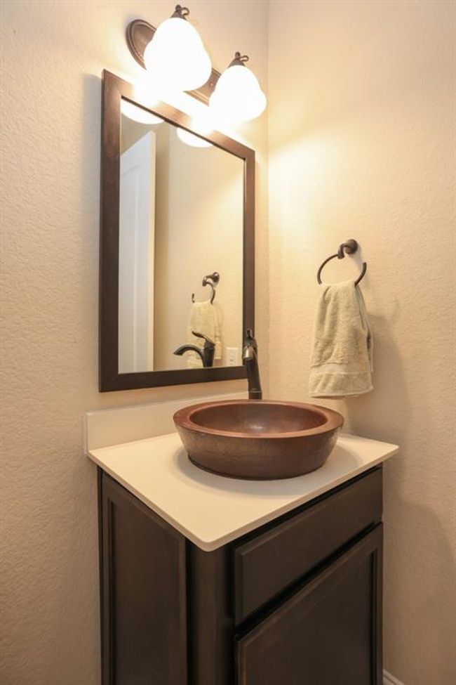 Powder bath with copper sink and oil rubbed bronze faucet and towel rack | Image 31