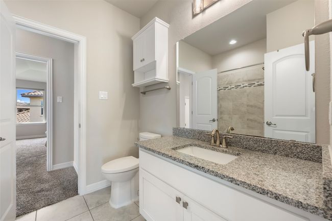 Full bathroom featuring vanity, tile patterned floors, and a tile shower | Image 26