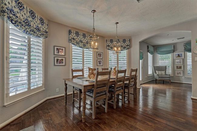 Around the corner from Breakfast area and Kitchen you'll find the Bonus Room - Craft/Sun Room also with outdoor access to backyard and pool. | Image 22