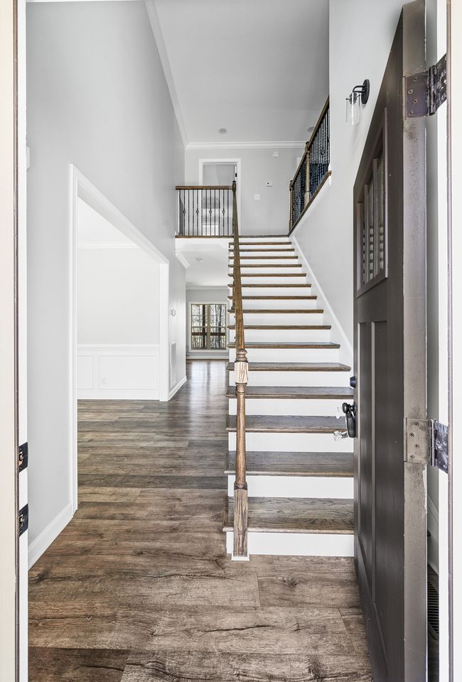 Entry hall with hardwood stairs. | Image 17