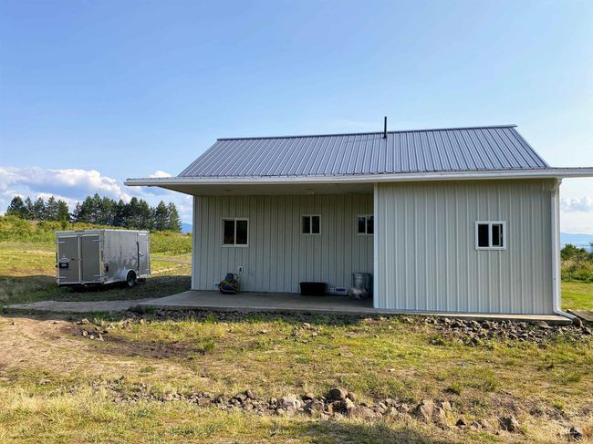 Back of house featuring a metal roof and a patio | Image 9
