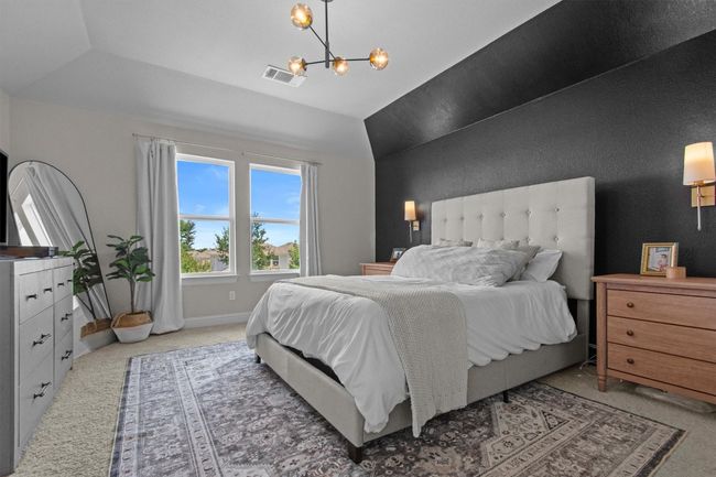 Bedroom featuring carpet, a chandelier, and vaulted ceiling | Image 22