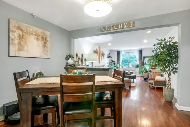 Dining space featuring dark wood-type flooring and recessed lighting | Image 7