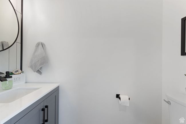 Bathroom featuring toilet and vanity | Image 25