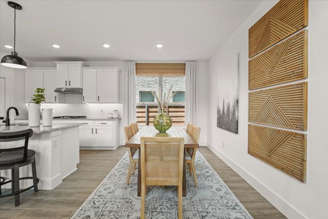 Dining room with wood finished floors and recessed lighting | Image 23