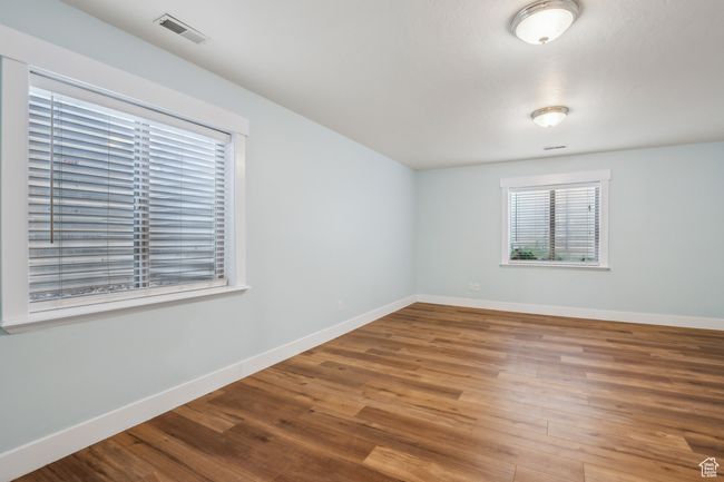 Spare room featuring hardwood / wood-style floors | Image 32