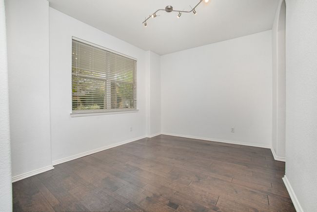 Unfurnished room featuring wood finished floors and baseboards | Image 14