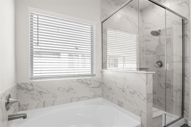 Full bathroom featuring a marble finish shower and a bath | Image 24