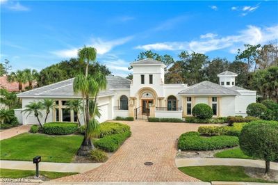 Mediterranean / spanish-style house featuring a garage | Image 2