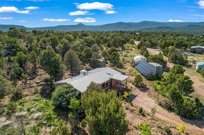 House, solar array, greenhouse, and two climate-controlled, electrified, and seismically qualified storage containers on permanent foundations with interior lighting | Image 47