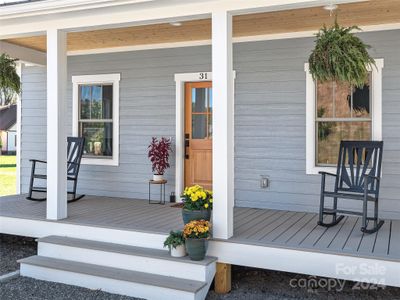 Greet neighbors from the expansive front porch. | Image 2