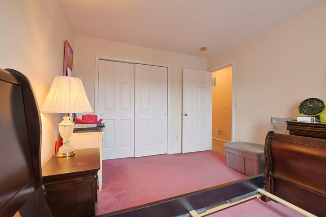 Carpeted bedroom featuring a closet | Image 14