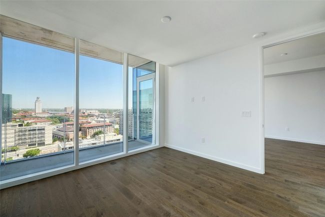Primary bedroom with city view, and expansive windows | Image 23