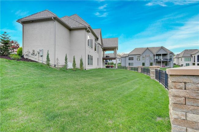 View of yard with a residential view and fence | Image 62