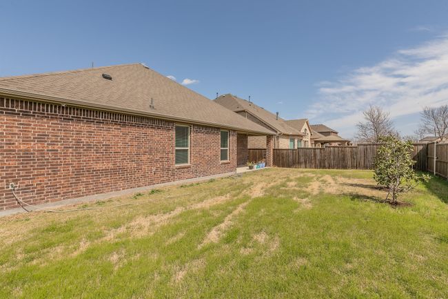 View of yard featuring a fenced backyard | Image 17