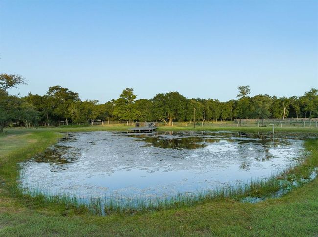 The pond features a dock, is stocked with bass and perch and is fed by its own well. | Image 46