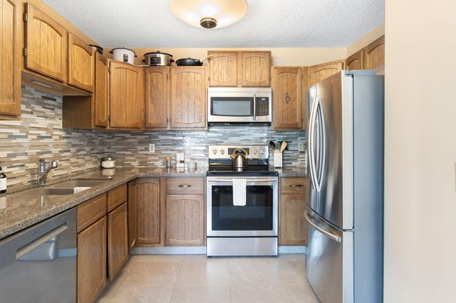 64 Cedarbrook Way Sw, Home with 4 bedrooms, 3 bathrooms and 2 parking in Calgary AB | Image 6