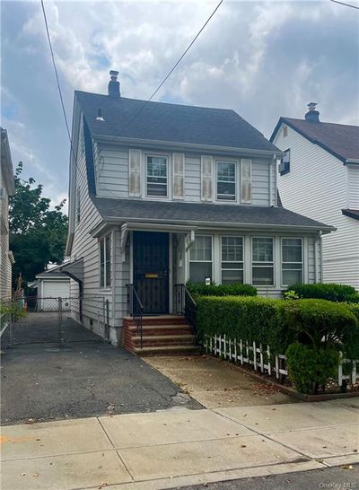 View of front of property featuring a garage | Image 1