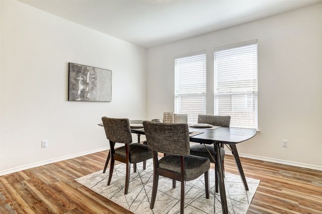 Dining space featuring light wood finished floors | Image 7