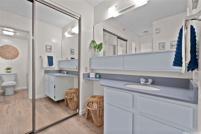 Spacious mirrored closet conveniently located near the bathroom vanity—separate from the bedroom for added functionality and privacy. A smart layout that maximizes storage and flow in this one-bedroom unit. | Image 15