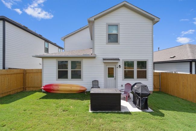 Back of house with a fenced backyard and a patio area | Image 28