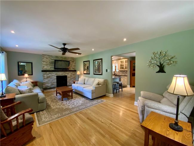 Main living area with a gas fireplace | Image 5
