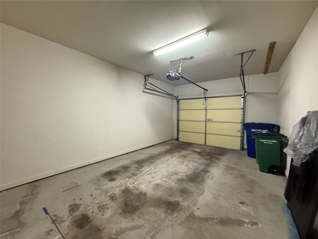 Garage featuring a garage door opener | Image 9