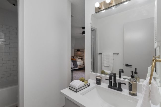 Full bath with ceiling fan, vanity, ensuite bathroom, and tub / shower combination | Image 30