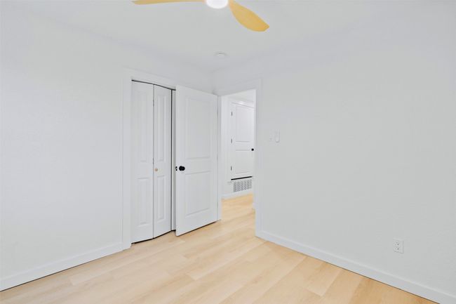 Spare room with light wood finished floors and a ceiling fan | Image 28
